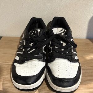 New Balance Men's Classic Black and White Sneakers
